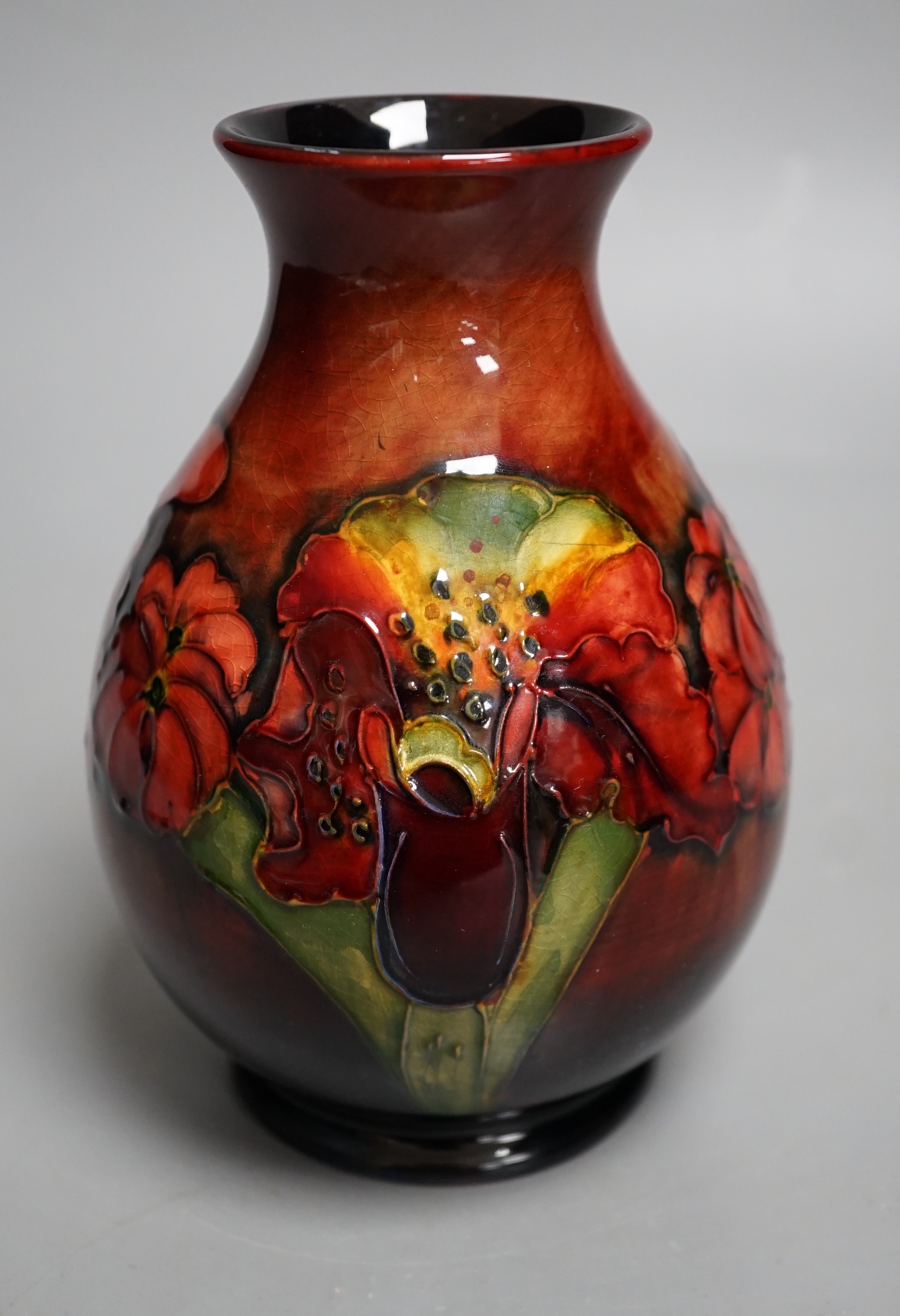 A Moorcroft flambé orchid pattern vase, 15cm